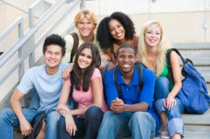 Group of university students sitting on steps